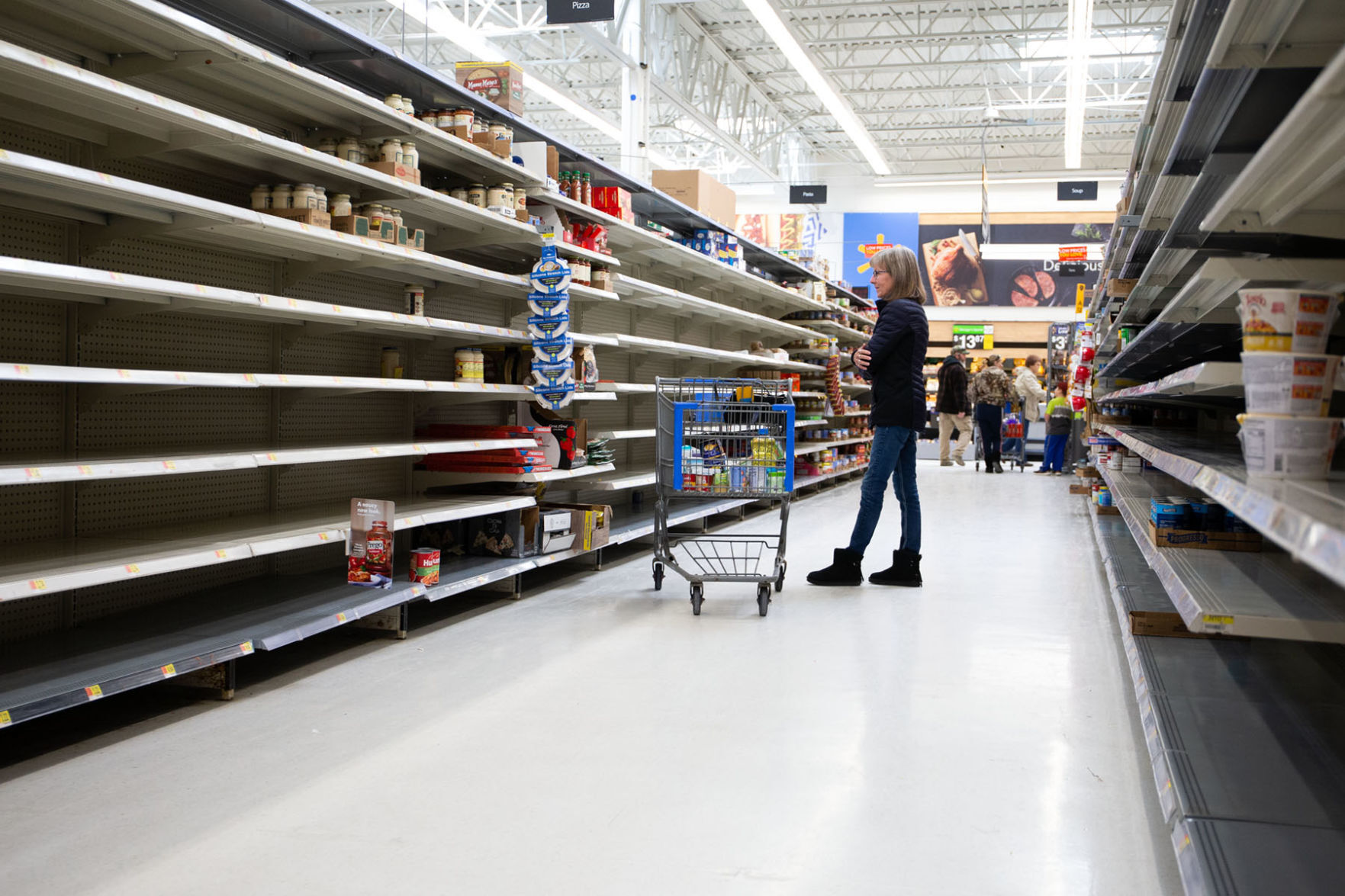 Shoppers at the Walmart store in Helena face empty shelves and limited supplies of items Monday